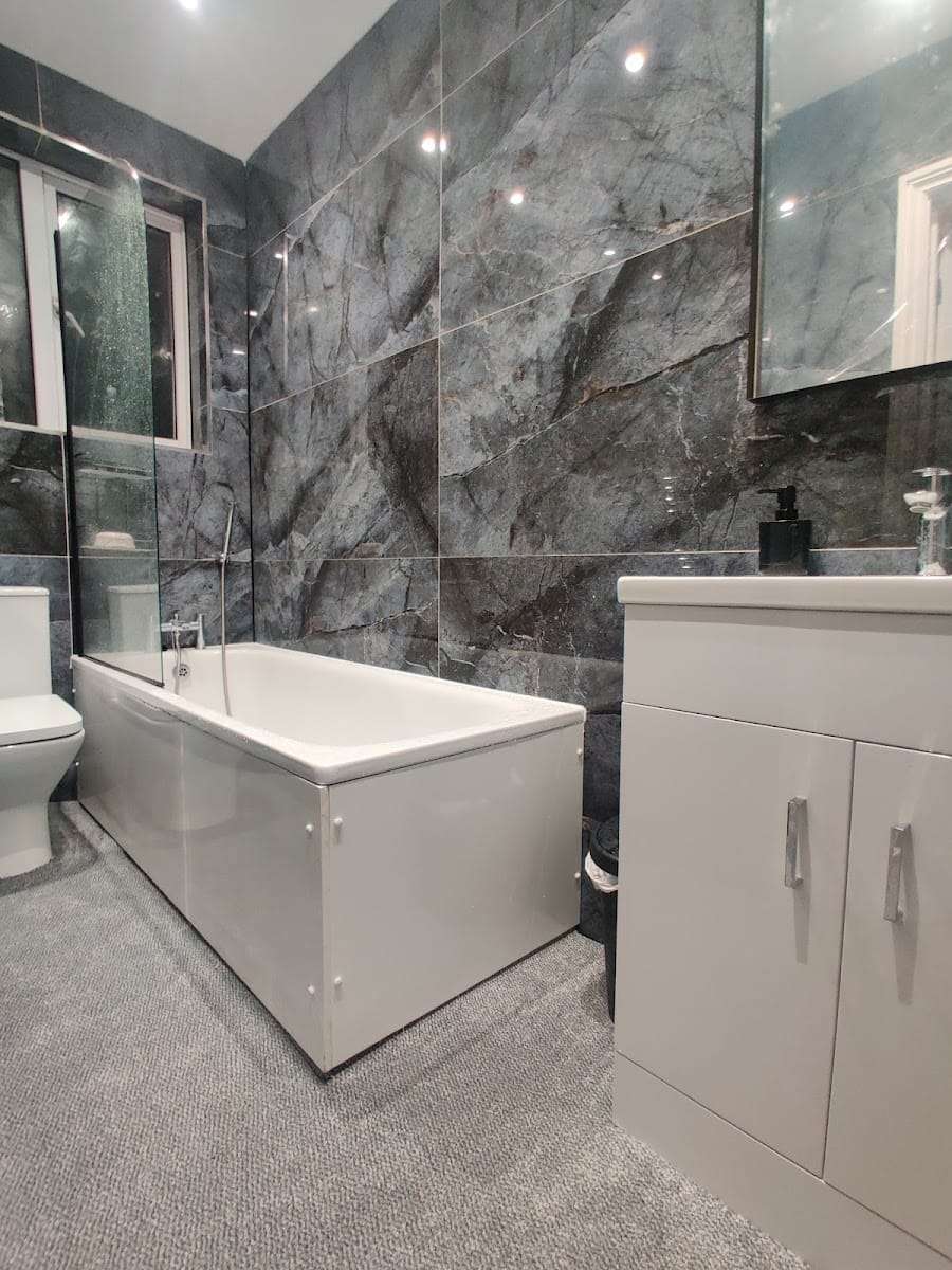 Marble effect bathroom, by Croydon Building Services Ltd